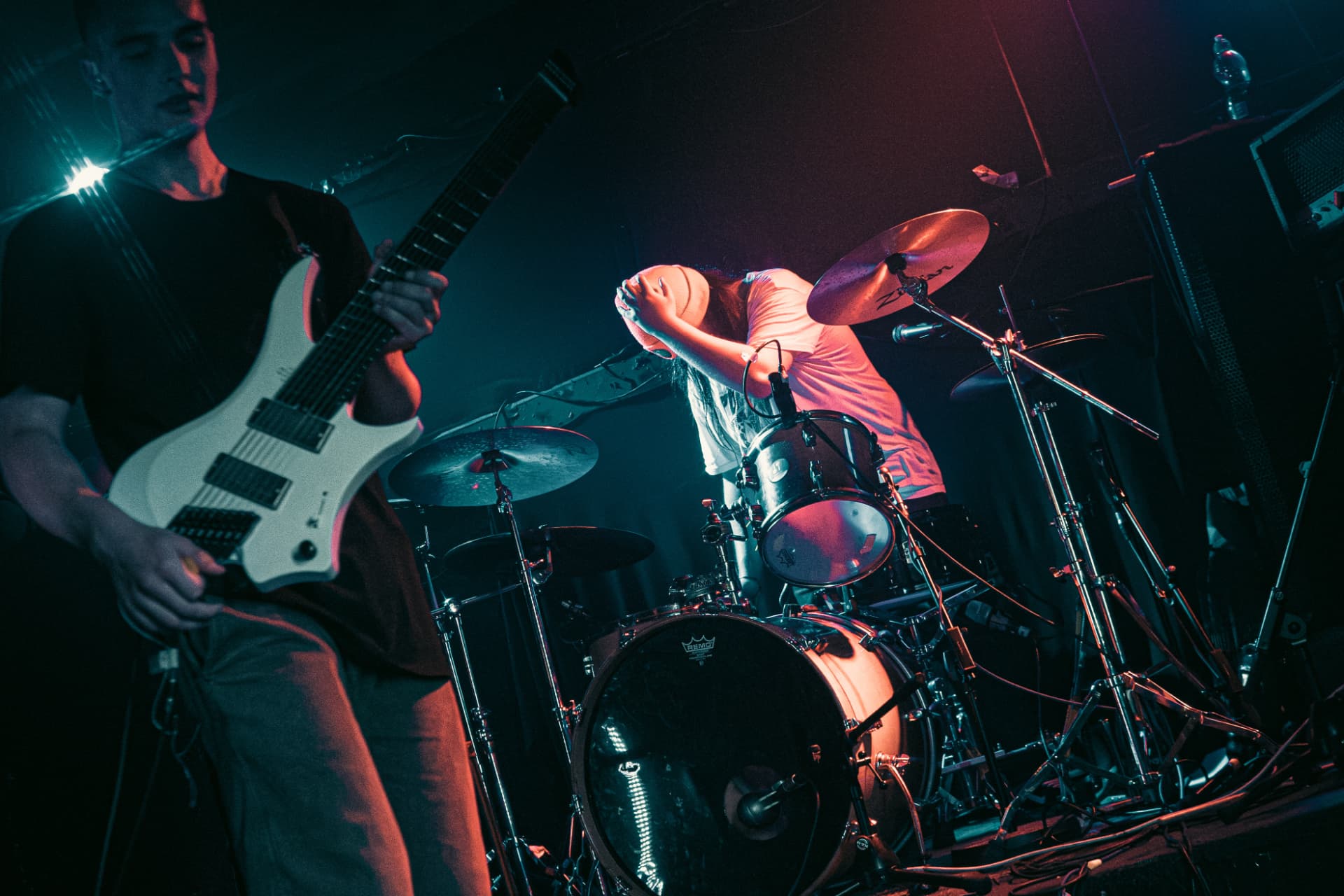 Cian performing live under stage lights, shot by Connor